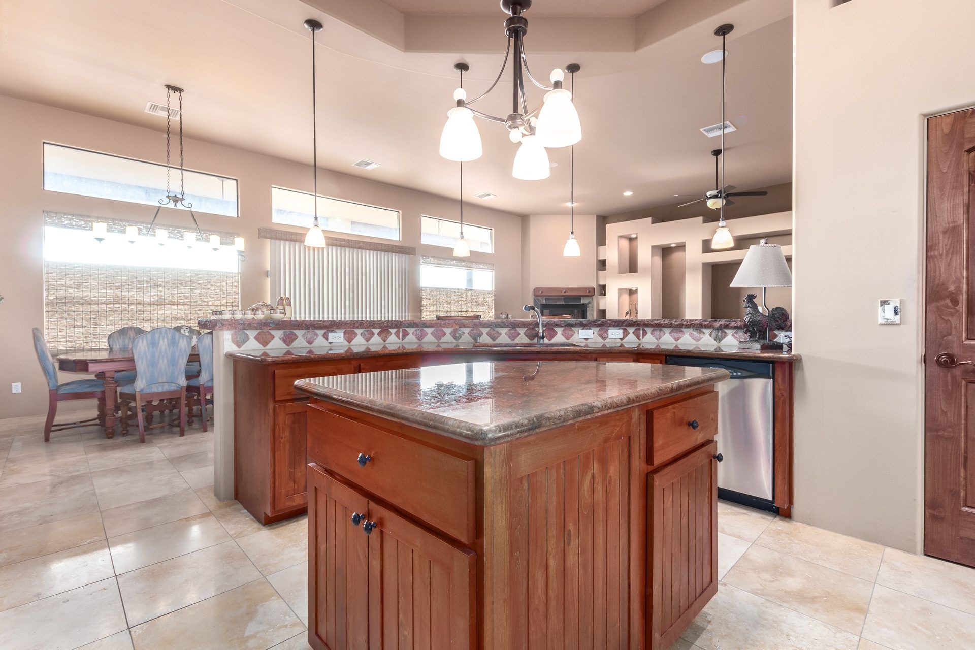 Kitchen with a large wood island and pendant lights